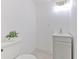 Modern half bathroom with a floating vanity and plant at 1028 Apollo Beach Blvd # 4, Apollo Beach, FL 33572