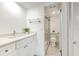 Modern bathroom with white vanity and a walk-in shower at 1028 Apollo Beach Blvd # 4, Apollo Beach, FL 33572