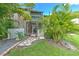 Private patio with stone pathway and tropical landscaping at 1028 Apollo Beach Blvd # 4, Apollo Beach, FL 33572