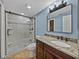 Updated bathroom with a walk-in shower, new vanity, and modern fixtures at 4317 Honey Vista Cir, Tampa, FL 33624