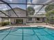 Inviting swimming pool with screened enclosure and patio area at 4317 Honey Vista Cir, Tampa, FL 33624