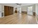 Large bedroom with wood-look floors, double closets and ceiling fan at 4317 Honey Vista Cir, Tampa, FL 33624