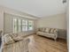 Living room with hardwood floors and beige sofas at 4317 Honey Vista Cir, Tampa, FL 33624