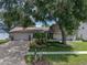 Beautiful home exterior with a large driveway and lush landscaping at 4317 Honey Vista Cir, Tampa, FL 33624