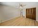 Spacious bedroom with wood flooring, double door closet and ceiling fan at 4317 Honey Vista Cir, Tampa, FL 33624