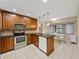 Modern kitchen with stainless steel appliances and dark wood cabinets at 4317 Honey Vista Cir, Tampa, FL 33624