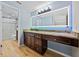 Bathroom with granite countertop, updated vanity, and walk-in shower at 4317 Honey Vista Cir, Tampa, FL 33624
