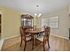 Elegant dining room with hardwood floors and a charming table setting at 4317 Honey Vista Cir, Tampa, FL 33624