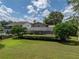 Large backyard with screened patio and spacious lawn at 4317 Honey Vista Cir, Tampa, FL 33624