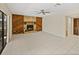 Gathering room with tile floors, stone fireplace and wood paneling at 4317 Honey Vista Cir, Tampa, FL 33624
