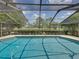 Inviting screened pool with a view of lush landscaping at 4317 Honey Vista Cir, Tampa, FL 33624