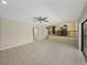 Spacious living room with tile flooring and a view of the dining area at 4317 Honey Vista Cir, Tampa, FL 33624