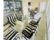 Sunroom dining area with waterfront views, tile floors, and ample natural light at 1819 Shore S Dr # 318, South Pasadena, FL 33707