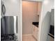 Charming pantry featuring white cabinetry, black countertops, and tiled flooring at 1819 Shore S Dr # 318, South Pasadena, FL 33707