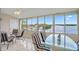 Inviting view of boats docked and waterway, seen from a cozy seating area with large windows at 1819 Shore S Dr # 318, South Pasadena, FL 33707