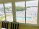 Waterfront view of the marina and pool from the light-filled sunroom at 1819 Shore S Dr # 318, South Pasadena, FL 33707