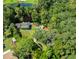 Beautiful aerial view of home with lush surroundings, dock and lake at 4617 John Moore Rd, Brandon, FL 33511