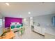 Charming bedroom features a vibrant accent wall and convenient kitchenette at 4617 John Moore Rd, Brandon, FL 33511
