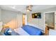 Bedroom with a ceiling fan and an attached bathroom at 4617 John Moore Rd, Brandon, FL 33511