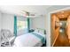 Cozy bedroom with ample natural light, a ceiling fan, and stylish, modern decor at 4617 John Moore Rd, Brandon, FL 33511