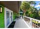 Outdoor deck with dining furniture and serene view at 4617 John Moore Rd, Brandon, FL 33511