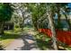 Scenic driveway leading to the home surrounded by mature trees and lush greenery at 4617 John Moore Rd, Brandon, FL 33511