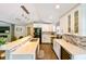 Modern kitchen with white cabinetry, stainless steel appliances, and counter seating at 4617 John Moore Rd, Brandon, FL 33511