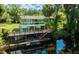 Stunning waterfront home with a spacious deck and lush surroundings at 4617 John Moore Rd, Brandon, FL 33511