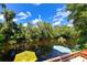 Scenic view from the deck, overlooking the tranquil water and lush green trees at 4617 John Moore Rd, Brandon, FL 33511