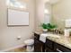 Clean, bright bathroom with granite countertop, dark wood vanity, and modern fixtures at 6404 Key Island Ave, Apollo Beach, FL 33572