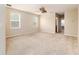 Spacious carpeted bedroom with neutral walls and abundant natural light at 6404 Key Island Ave, Apollo Beach, FL 33572