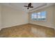 Spacious bedroom with tile flooring, ceiling fan and large window at 6404 Key Island Ave, Apollo Beach, FL 33572