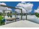 Exterior view of a private boat lift and wooden dock overlooking the calm water in a serene waterfront community at 6404 Key Island Ave, Apollo Beach, FL 33572