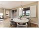 Cozy dining area with a round table, stylish chairs, and a view of the outdoors, perfect for Gathering meals at 6404 Key Island Ave, Apollo Beach, FL 33572