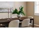 Cozy dining room showcasing modern decor and an elegant table setting with seating for six at 6404 Key Island Ave, Apollo Beach, FL 33572