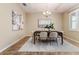 Bright dining room with a classic table, chairs, decorative art, and ample natural light at 6404 Key Island Ave, Apollo Beach, FL 33572