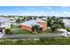 Aerial view of home, fenced backyard, and mature tropical landscaping offering ultimate privacy and outdoor enjoyment at 6404 Key Island Ave, Apollo Beach, FL 33572