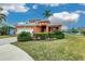 Charming two-story home features a well-manicured lawn, beautiful landscaping, and a two car garage at 6404 Key Island Ave, Apollo Beach, FL 33572