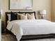 Comfortable main bedroom with plush bedding, neutral decor and updated ceiling fan at 6404 Key Island Ave, Apollo Beach, FL 33572