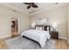 Spacious main bedroom with tray ceiling, ceiling fan and ensuite access at 6404 Key Island Ave, Apollo Beach, FL 33572