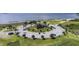 Aerial view of a parking lot near a beach and pier in a lovely coastal area at 6404 Key Island Ave, Apollo Beach, FL 33572