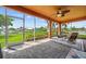 Spacious patio with a ceiling fan and nice tile flooring offers the perfect outdoor entertaining space at 6404 Key Island Ave, Apollo Beach, FL 33572