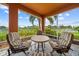 Relaxing screened-in patio features comfortable seating, nice tile flooring and a stunning waterfront view at 6404 Key Island Ave, Apollo Beach, FL 33572