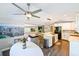 Open concept kitchen with white cabinets, island and view into living room at 4617 John Moore Rd, Brandon, FL 33511