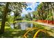 Charming pond with fountain in a wooded backyard setting at 4617 John Moore Rd, Brandon, FL 33511