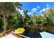 Relaxing waterfront deck with colorful umbrellas and scenic river views at 4617 John Moore Rd, Brandon, FL 33511