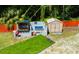 Outdoor patio with seating, bar, and cornhole game at 4617 John Moore Rd, Brandon, FL 33511
