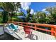 Waterfront dock with colorful Adirondack chairs, offering peaceful views at 4617 John Moore Rd, Brandon, FL 33511