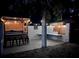 Night view of outdoor patio with bar and string lights at 4617 John Moore Rd, Brandon, FL 33511