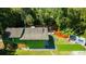 Aerial view of green house, backyard patio, and river at 4617 John Moore Rd, Brandon, FL 33511